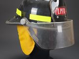 fireman ' s helmet with face shield and visor on display