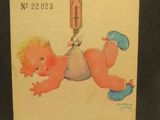 une vieille carte postale sur laquelle figure la photo d'un bébé