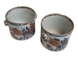 pair of blue and white vases with floral designs on them