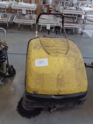 a yellow machine that is sitting on the floor
