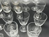 a lot of empty wine glasses sitting on a table