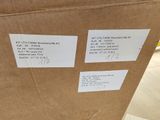 a cardboard box that has some stickers on it