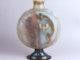 a vase with a picture of a man and a woman on it