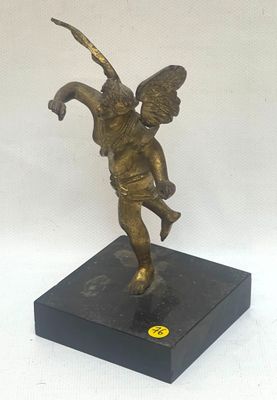 statue of an angel holding a bird on a black base