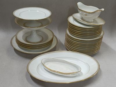 a stack of plates with a bird on top of them