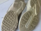 the soles of a pair of shoes are shown on a white surface