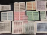 a table topped with lots of different types of stamps on top of each other