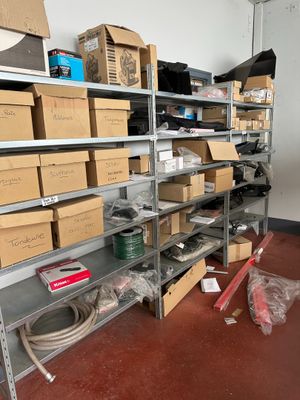 a room with a lot of boxes and boxes on the shelves