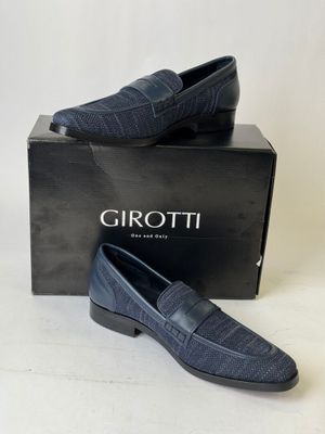 a pair of men ' s shoes in a box on a white background