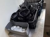 pots and pans on a counter in a kitchen with a window