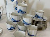 a lot of cups and saucers that are on the table