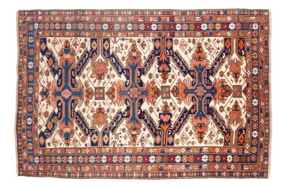 tapis persan ancien à motifs bleus et rouges
