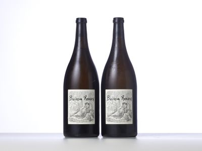 two bottles of wine sitting on top of a table next to each other