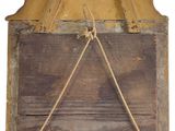 a wooden sign hanging on the wall with a rope