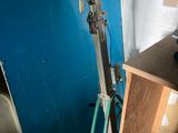 a bike leaning against a blue wall in a room