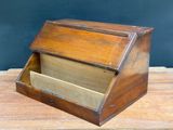 an old wooden box with two drawers on a wooden table