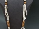 a close up of a necklace on a mannequin mannequin
