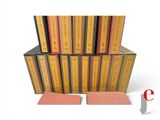 a lot of books stacked on top of each other