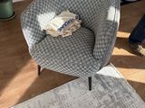 a chair that is sitting in the middle of a living room