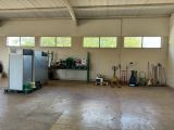 an image of a garage with a refrigerator and other tools