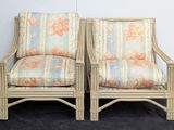 pair of vintage rattan chairs with floral upholstered cushions
