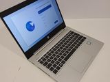 a laptop that is sitting on a table with a mouse