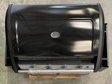 an overhead view of an outdoor grill with the lid open