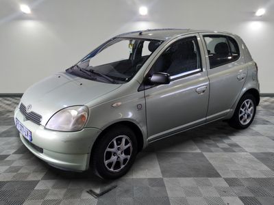 a picture of a silver car parked in a garage