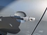 a shadow of a person on the door of a car