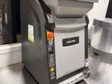 a machine that is sitting on the counter in the kitchen