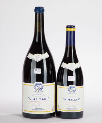 two bottles of wine sitting next to each other on a white surface