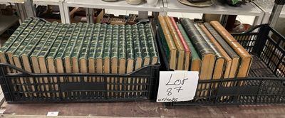 many stacks of books on a shelf in a store