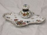 a white plate with a flowered design on it