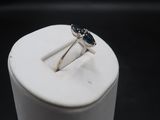 a close up of a ring sitting on top of a white box