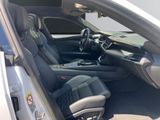 the interior of a car with the door open and the driver ' s seat up