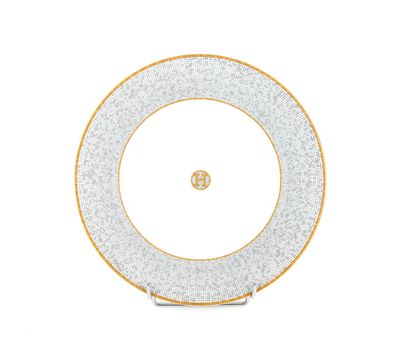 a white and gold dinner plate with a gold rim