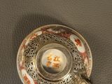a cup and saucer sitting on a table
