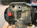 a close up of a motor on a wooden pallet