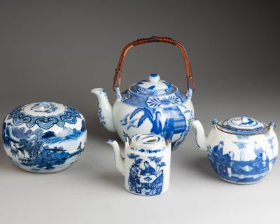 three blue and white teapots and a tea pot