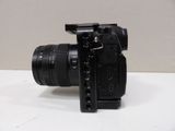 a camera with a lens attached to it on a table