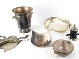 a lot of silver items that are on the table