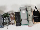a lot of toy cars that are lined up on the wall