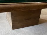 a pool table that has a glass top on it