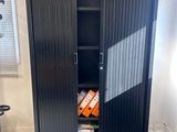 an image of a black metal cabinet in a room