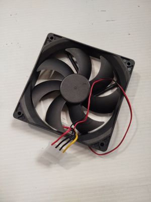 a close up of a fan on a table with wires