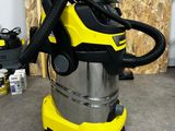yellow and black wet vacuum cleaner machine sitting on the floor