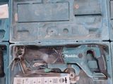 a blue box with tools inside of it on the floor