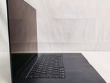 an open laptop computer sitting on top of a white surface