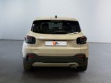 the rear end of a beige suv parked in a white room