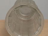 a plastic container with a lid on a wooden table